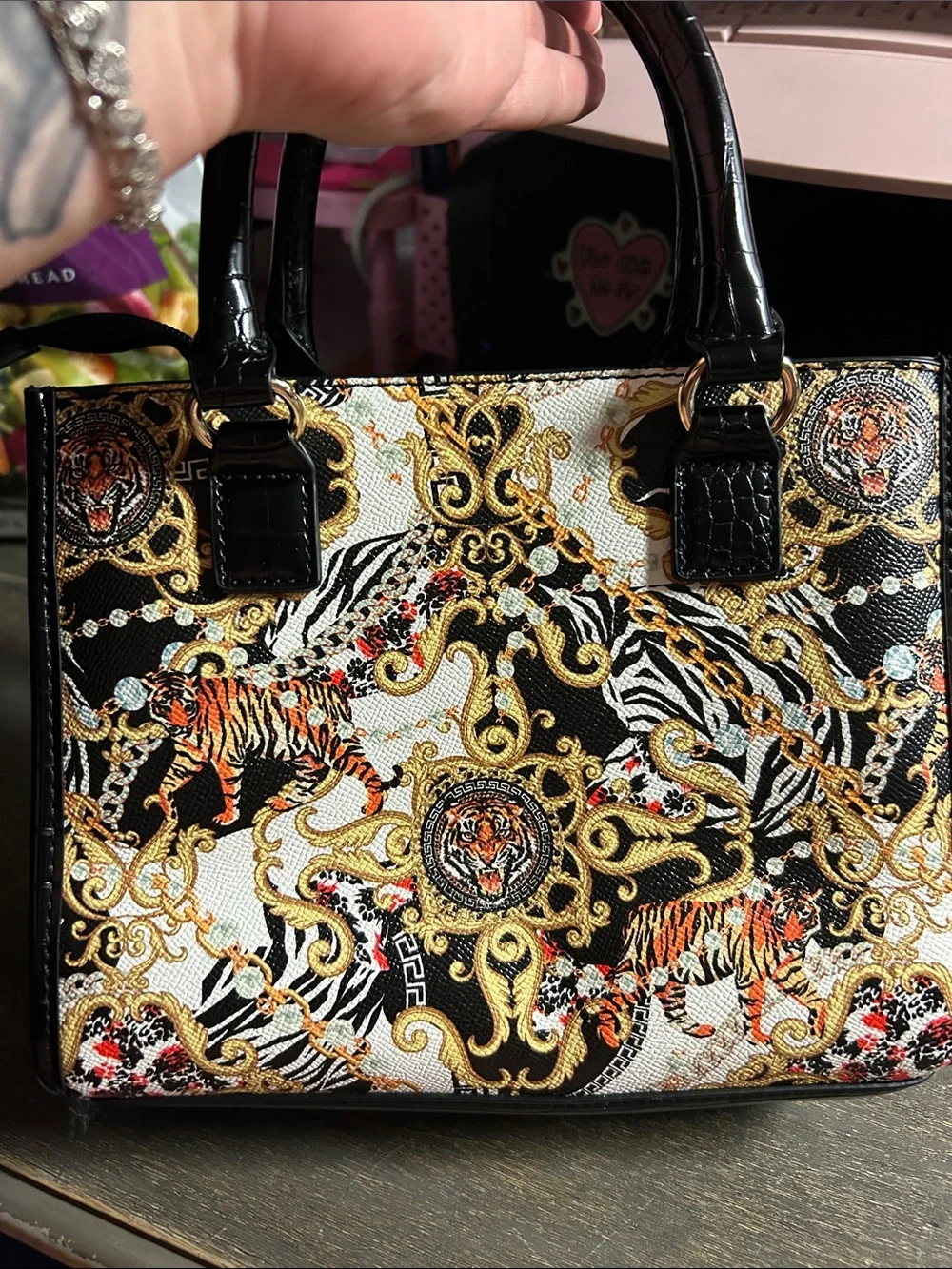 Aldo Aboma handbag features a black and gold baroque multi-pattern small Bag